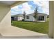 Private backyard with grassy area and patio at 2204 Mac Blvd, Eagle Lake, FL 33839