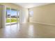 Spacious living area with tile floors and sliding glass doors at 2204 Mac Blvd, Eagle Lake, FL 33839