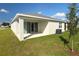 Newly built home with covered patio and grassy backyard at 2204 Mac Blvd, Eagle Lake, FL 33839