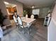 Bright dining room features a table with six chairs and kitchen views at 866 Crows Bluff Ln, Sanford, FL 32773