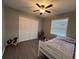 Bedroom with double bed, ceiling fan and large closet at 866 Crows Bluff Ln, Sanford, FL 32773