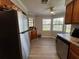 Kitchen boasts stainless steel appliances and wood cabinets at 866 Crows Bluff Ln, Sanford, FL 32773