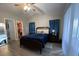 Spacious bedroom with a queen-size bed and walk-in closet at 866 Crows Bluff Ln, Sanford, FL 32773