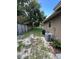 Side yard with grassy area and AC unit at 866 Crows Bluff Ln, Sanford, FL 32773