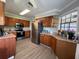 Updated kitchen with stainless steel appliances and wood cabinets at 866 Crows Bluff Ln, Sanford, FL 32773