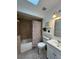 Bathroom with tub, skylight, and updated fixtures at 866 Crows Bluff Ln, Sanford, FL 32773
