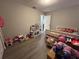 bedroom with plenty of space for toys and games at 866 Crows Bluff Ln, Sanford, FL 32773