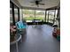 Relaxing screened porch with seating area and view of backyard at 866 Crows Bluff Ln, Sanford, FL 32773