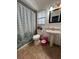 Updated bathroom with tub, toilet, and pedestal sink at 866 Crows Bluff Ln, Sanford, FL 32773