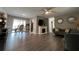 Open living room with hardwood floors, fireplace, and dining area at 866 Crows Bluff Ln, Sanford, FL 32773