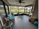 Screened porch overlooking the backyard, with table and seating at 866 Crows Bluff Ln, Sanford, FL 32773