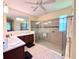 Spa-like bathroom with walk-in shower and double vanity at 465 Villa Park Rd, Poinciana, FL 34759
