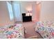 Bedroom with two twin beds and dresser at 465 Villa Park Rd, Poinciana, FL 34759
