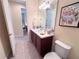 Small bathroom with toilet and sink at 465 Villa Park Rd, Poinciana, FL 34759