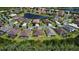 Aerial view of a house in a residential community near a lake at 465 Villa Park Rd, Poinciana, FL 34759
