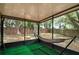 Relaxing screened porch with hammock, overlooking a fenced backyard at 2912 Willow Oak Ct, Kissimmee, FL 34744