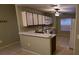 Small kitchen with white cabinets and tiled floors at 2912 Willow Oak Ct, Kissimmee, FL 34744