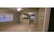 Open living room and kitchen with tiled floors and ceiling fans at 2912 Willow Oak Ct, Kissimmee, FL 34744