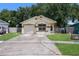 Single-story house with attached garage and driveway at 2912 Willow Oak Ct, Kissimmee, FL 34744