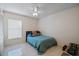 Bedroom with a bed, ceiling fan and window coverings at 2912 Willow Oak Ct, Kissimmee, FL 34744