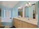 Bathroom with double vanity and large mirror at 2912 Willow Oak Ct, Kissimmee, FL 34744