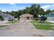 House exterior featuring a single-story home with a driveway and lawn at 2912 Willow Oak Ct, Kissimmee, FL 34744