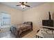 Simple bedroom with a double bed and a work desk at 2912 Willow Oak Ct, Kissimmee, FL 34744