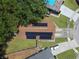 Aerial view of house with solar panels on roof at 2912 Willow Oak Ct, Kissimmee, FL 34744