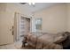 Bright bedroom with double bed, closet, and window at 2912 Willow Oak Ct, Kissimmee, FL 34744