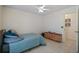 Cozy bedroom with a bed, ceiling fan and access to bathroom at 2912 Willow Oak Ct, Kissimmee, FL 34744