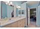 Bathroom with double vanity and access to bedroom at 2912 Willow Oak Ct, Kissimmee, FL 34744