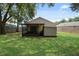 Large backyard with a shed and screened porch at 2912 Willow Oak Ct, Kissimmee, FL 34744