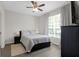Comfortable bedroom with a queen-size bed and large window at 13103 Mulberry Park Dr # 8211, Orlando, FL 32821