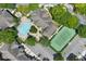 An aerial view of a community pool and tennis court at 13103 Mulberry Park Dr # 8211, Orlando, FL 32821