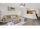 Open living room with sectional sofa and built-in entertainment center at 13103 Mulberry Park Dr # 8211, Orlando, FL 32821