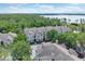 Community near a lake with lush landscaping at 13103 Mulberry Park Dr # 8211, Orlando, FL 32821