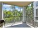 Peaceful screened balcony overlooking lush greenery at 13103 Mulberry Park Dr # 8211, Orlando, FL 32821