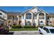 Two-story condo building with brick accents and landscaping at 5014 Laguna Bay Cir # 108, Kissimmee, FL 34746