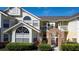Two-story condo building with brick accents and balconies at 5014 Laguna Bay Cir # 108, Kissimmee, FL 34746