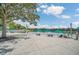 Relaxing lakefront patio with seating and umbrellas at 500 Mirasol Cir # 105, Celebration, FL 34747