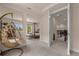 Spacious loft area with a hanging chair and access to bedrooms at 7650 Wandering Way, Orlando, FL 32836
