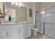 Bathroom with shower, toilet, and vanity at 7650 Wandering Way, Orlando, FL 32836