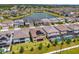 Aerial perspective showcasing the community and a serene lake at 7650 Wandering Way, Orlando, FL 32836
