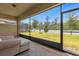 Relaxing screened porch overlooking a lush backyard at 7650 Wandering Way, Orlando, FL 32836