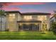 Stunning two-story home with solar panels and a screened porch at 7650 Wandering Way, Orlando, FL 32836