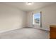 Bright bedroom with a window and neutral decor at 7650 Wandering Way, Orlando, FL 32836