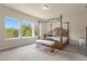 Main bedroom with large windows and a four poster bed at 7650 Wandering Way, Orlando, FL 32836