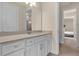 Clean bathroom, featuring a white vanity and tan countertop at 7650 Wandering Way, Orlando, FL 32836