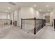 Upstairs hallway with carpeted floors and an open railing at 7650 Wandering Way, Orlando, FL 32836