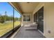 Spacious screened patio with comfortable seating and backyard access at 7650 Wandering Way, Orlando, FL 32836